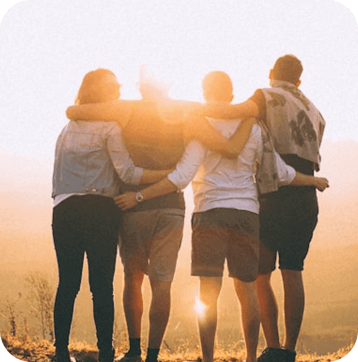 People hugging outdoors