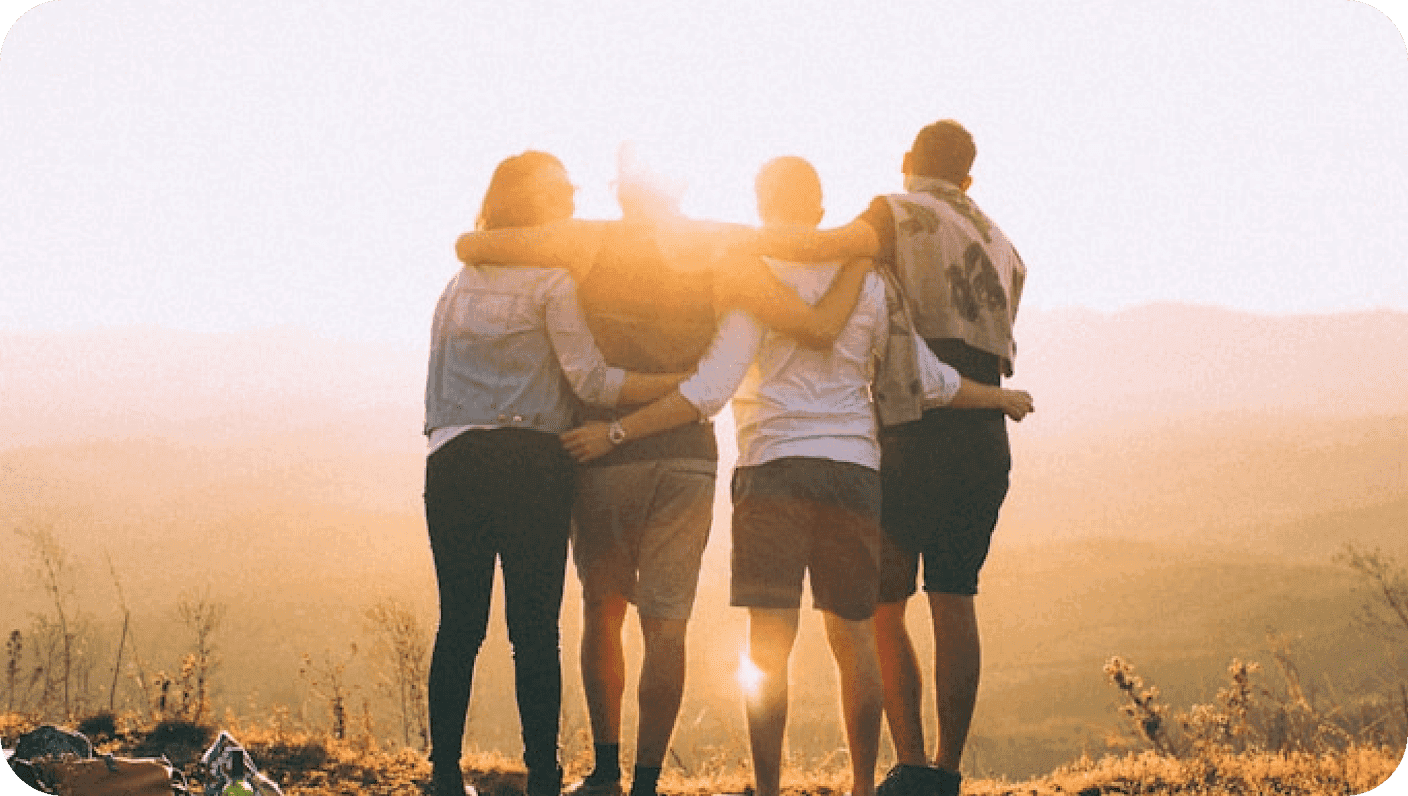 People hugging outdoors